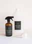 Two bottles of all-purpose cleaner on a white background
